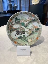 A Chinese famille verte 'warriors on horseback' dish, lingzhi mark, Kangxi