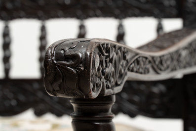 A Dutch colonial carved and ebonized wooden bench, 18th C.