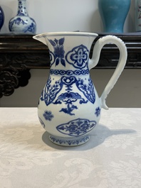 A Chinese blue and white jug with floral design, Kangxi