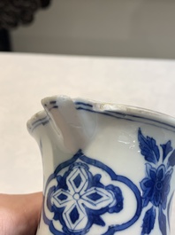 A Chinese blue and white jug with floral design, Kangxi