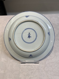 A pair of Chinese blue and white 'dragon' plates and a plate with narrative design, Yuzhen mark, Kangxi/Yongzheng
