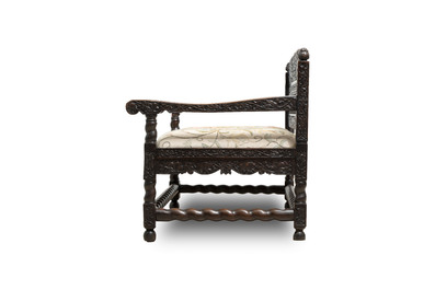 A Dutch colonial carved and ebonized wooden bench, 18th C.