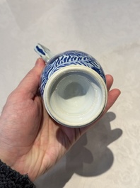 A pair of Chinese blue and white jugs and covers with floral design, Kangxi