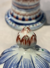 A pair of Chinese famille verte vases and covers with floral design, Kangxi