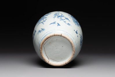 A Chinese blue and white vase with floral design and wooden cover, Transitional period