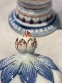 A pair of Chinese famille verte vases and covers with floral design, Kangxi