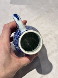 A pair of Chinese blue and white jugs and covers with floral design, Kangxi