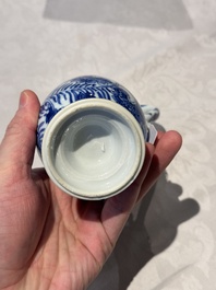 A pair of Chinese blue and white jugs and covers with floral design, Kangxi