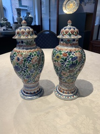 A pair of Chinese famille verte vases and covers with floral design, Kangxi
