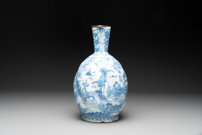 A large blue and white Dutch Delft chinoiserie jug with a mounted pewter lid, 17th C.
