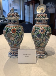 A pair of Chinese famille verte vases and covers with floral design, Kangxi