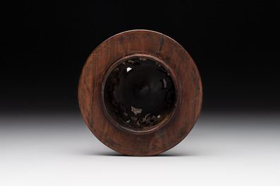 A Chinese blue and white vase with floral design and wooden cover, Transitional period