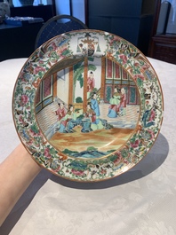 A pair of Chinese Canton famille rose armorial plates, 19th C.