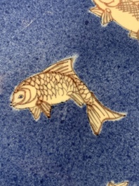 A Chinese blue, white and copper-red powder-blue-ground 'fish' dish, Kangxi