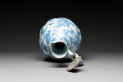 A large blue and white Dutch Delft chinoiserie jug with a mounted pewter lid, 17th C.