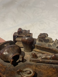 A Chinese agarwood carving of a miniature table with antiquities, 18/19th C.