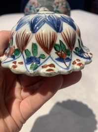 A pair of Chinese famille verte vases and covers with floral design, Kangxi