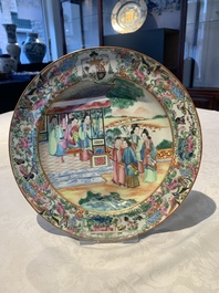 A pair of Chinese Canton famille rose armorial plates, 19th C.