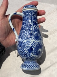 A pair of Chinese blue and white jugs and covers with floral design, Kangxi