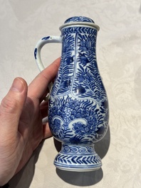 A pair of Chinese blue and white jugs and covers with floral design, Kangxi