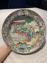 A pair of Chinese Canton famille rose armorial plates, 19th C.