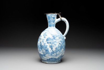 A large blue and white Dutch Delft chinoiserie jug with a mounted pewter lid, 17th C.