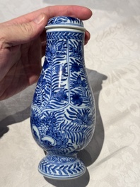 A pair of Chinese blue and white jugs and covers with floral design, Kangxi