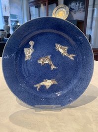 A Chinese blue, white and copper-red powder-blue-ground 'fish' dish, Kangxi