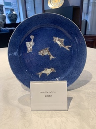 A Chinese blue, white and copper-red powder-blue-ground 'fish' dish, Kangxi