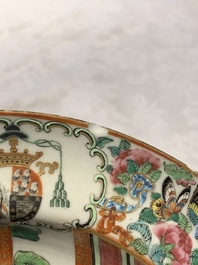 A pair of Chinese Canton famille rose armorial plates, 19th C.