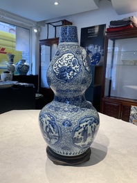 An impressive Chinese blue and white 'Eight Immortals' double gourd vase, Jiajing/Wanli