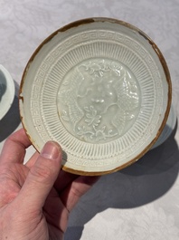 A pair of Chinese qingbai 'crane' plates and a tea bowl with stand, Song/Yuan