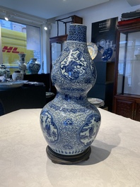 An impressive Chinese blue and white 'Eight Immortals' double gourd vase, Jiajing/Wanli