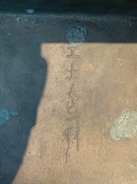 A Chinese archaic bronze ritual wine vessel, 'yi 彝', Shang