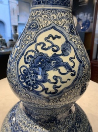 An impressive Chinese blue and white 'Eight Immortals' double gourd vase, Jiajing/Wanli