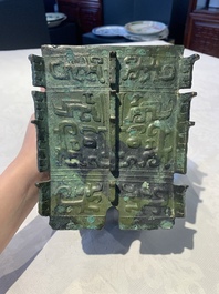 A Chinese archaic bronze ritual wine vessel, 'yi 彝', Shang