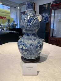 An impressive Chinese blue and white 'Eight Immortals' double gourd vase, Jiajing/Wanli