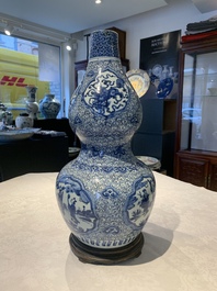 An impressive Chinese blue and white 'Eight Immortals' double gourd vase, Jiajing/Wanli