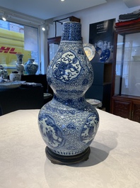 An impressive Chinese blue and white 'Eight Immortals' double gourd vase, Jiajing/Wanli