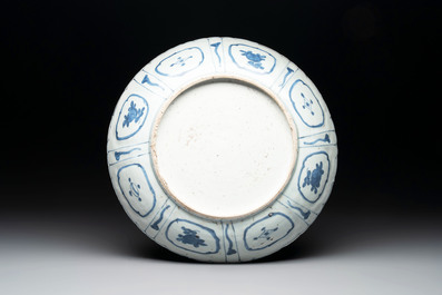 A Chinese blue and white 'kraak' dish with Damo in a landscape, Wanli