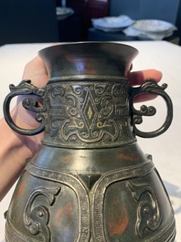 A Chinese archaistic gold- and silver-inlaid bronze vase with pseudo-rust patina, 19th C.