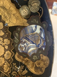 A Japanese-lacquered Chinese blue and white dish and a Japanese Kutani 'phoenix' dish, Wanli/19th C.