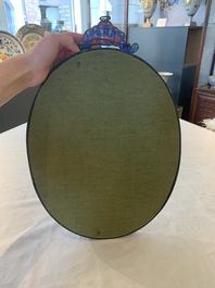 A large oval Chinese Canton enamel mirror, Qianlong