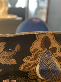A Japanese-lacquered Chinese blue and white dish and a Japanese Kutani 'phoenix' dish, Wanli/19th C.
