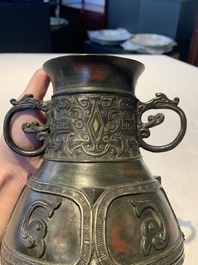 A Chinese archaistic gold- and silver-inlaid bronze vase with pseudo-rust patina, 19th C.