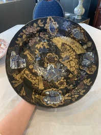 A Japanese-lacquered Chinese blue and white dish and a Japanese Kutani 'phoenix' dish, Wanli/19th C.