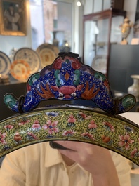A large oval Chinese Canton enamel mirror, Qianlong