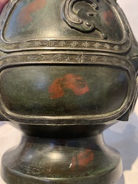 A Chinese archaistic gold- and silver-inlaid bronze vase with pseudo-rust patina, 19th C.