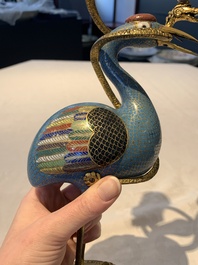 A pair of Chinese cloisonn&eacute; cranes, later mounted as candelabras, 18th C.