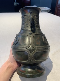 A Chinese archaistic gold- and silver-inlaid bronze vase with pseudo-rust patina, 19th C.